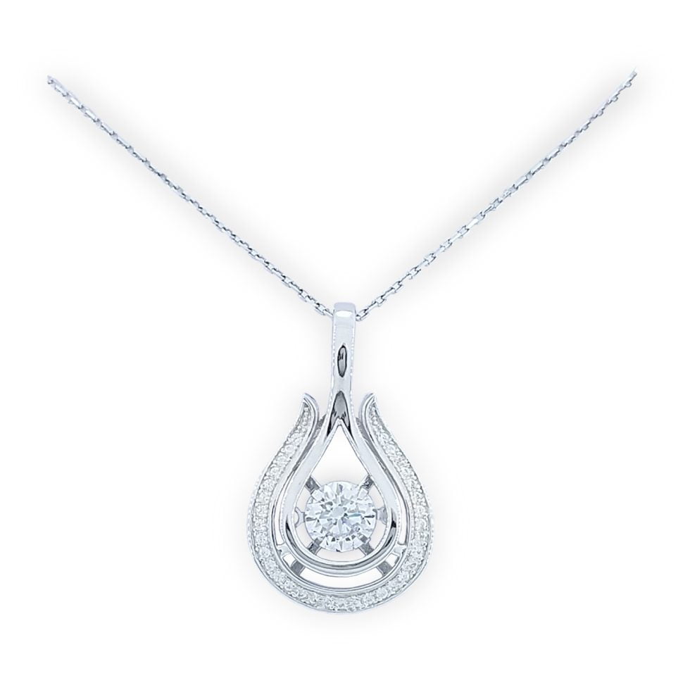 Dancing diamond center stone in tear drop shape mounting with open halo around center stone and "sash" of pave' set row of round CZs along lower border and attached bale