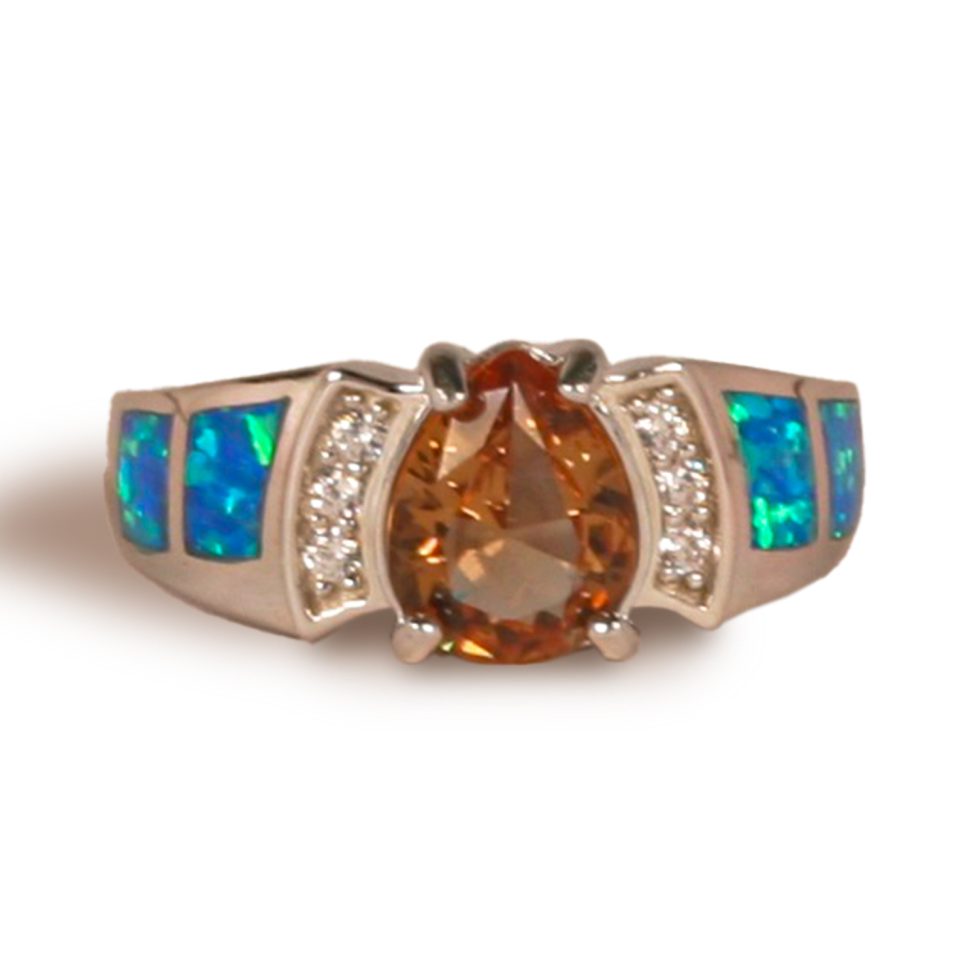 Prong set with three pave’ set round CZs in “channel” design along center stone flanked by two square sections of opal going down wide shank