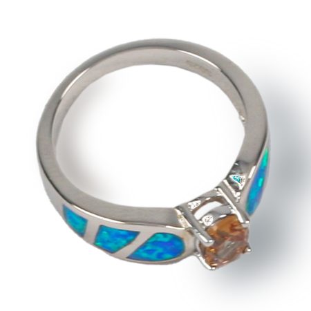 Prong set with three sections of opal on each side of curved shank